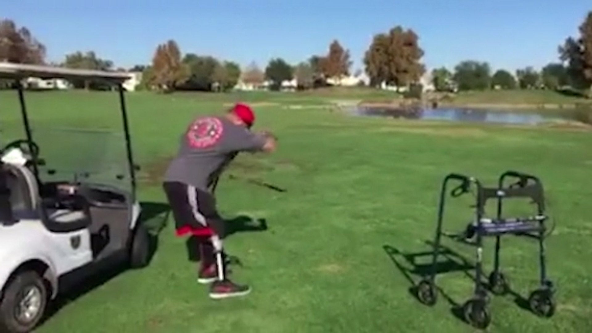 ABDUL NEVAREZ PLAYING GOLF STANDING UP WITHOUT WHEELCHAIR. HE SWINGS AND FALLS BACK BREAKING HIS LEFT WRIST