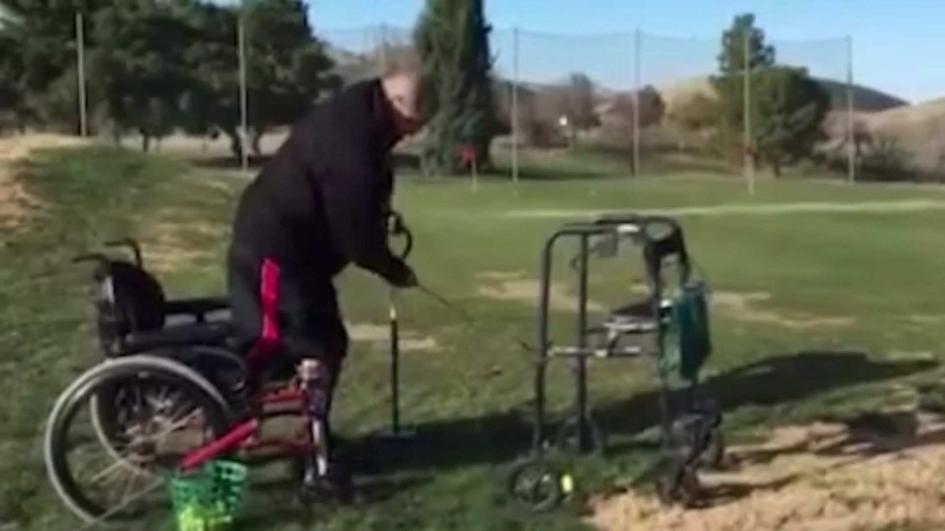 ABDUL NEVAREZ GOLFING FROM HIS WHEELCHAIR AND CANE